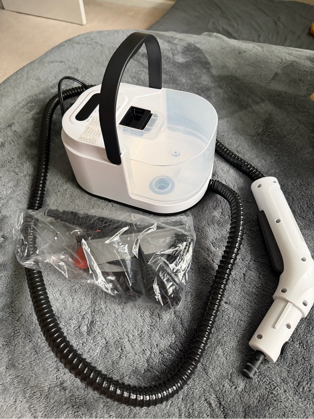 Amazon White Handheld Fabric Steamer with Black Hose and Handle